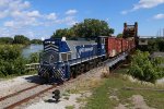 Y505 rolls over the Black River with interchange for CN